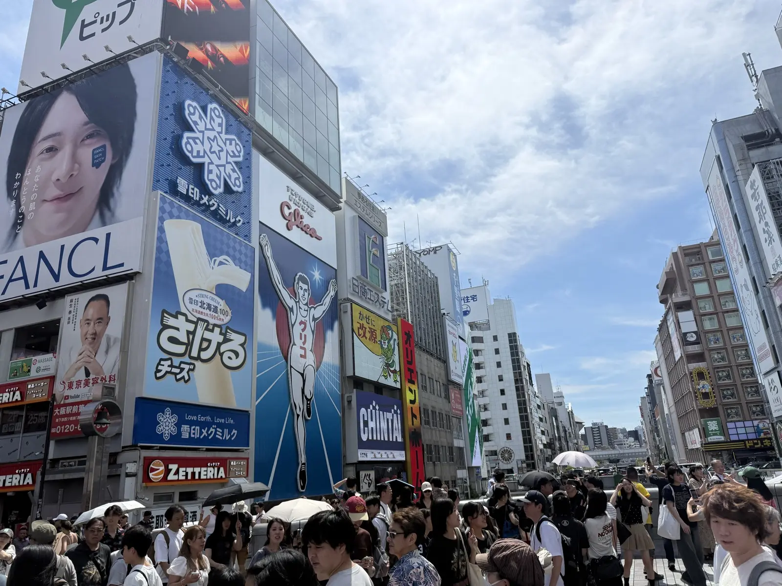The Glico sign over the Dotonbori canal in Osaka — eat like a local in Dotonbori and Namba